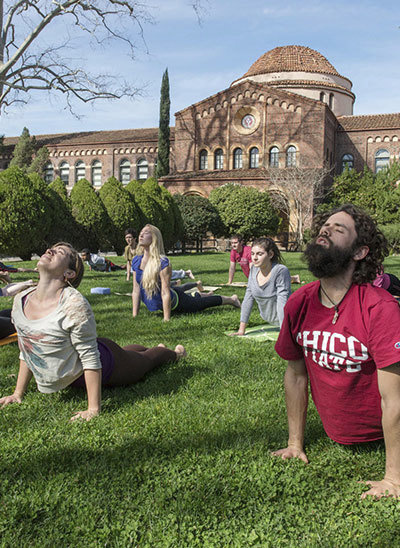Yoga in front of Kendall Hall