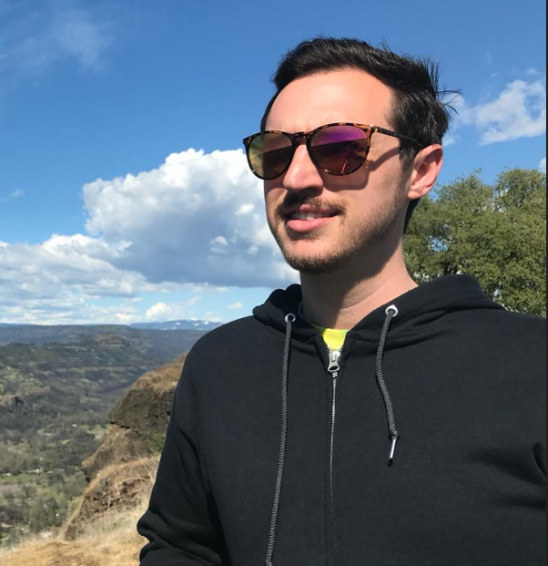 male wearing sunglasses on a hike