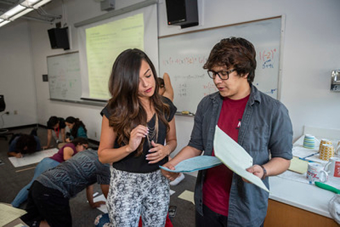 Christine Herrera Helping a Student