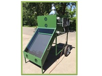 Green Solar Dehydrator sitting in the sun