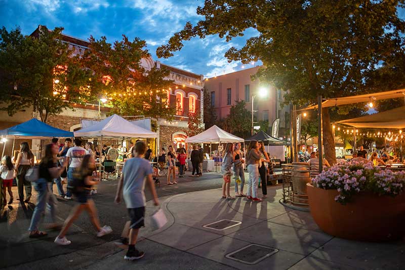 People gather at the Thursday Night Market downtown Chico