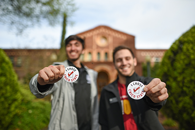 Two incoming freshman show off their "I Chose Chico" pins in front of Kendall