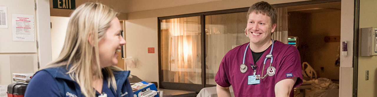 Nursing student Paul Herrick works during his day shift in the Intensive Care Un