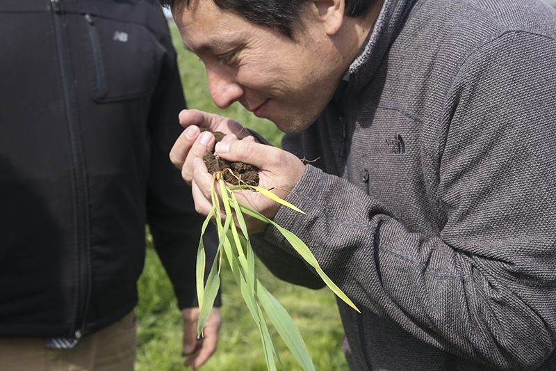 Santiago Utsumi enjoying the smell of healthy soil