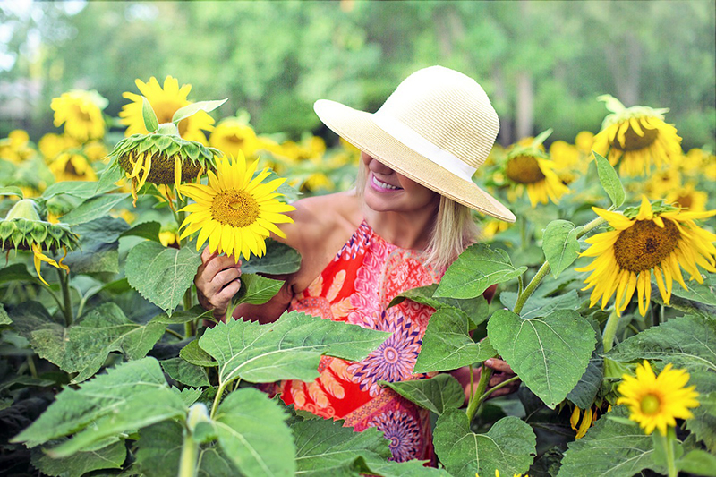 Woman in a field of sunflowers