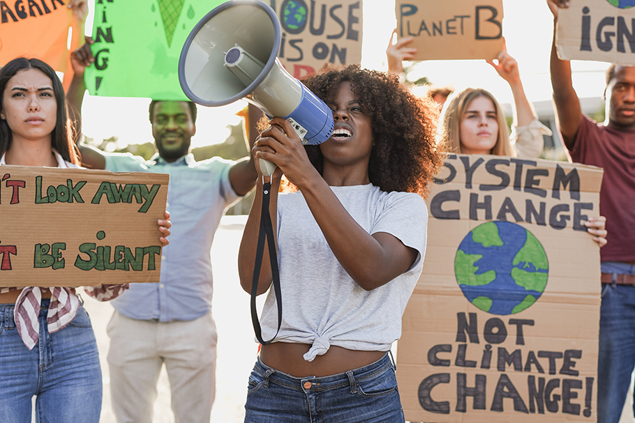 multiracial protesters shouting about climate change