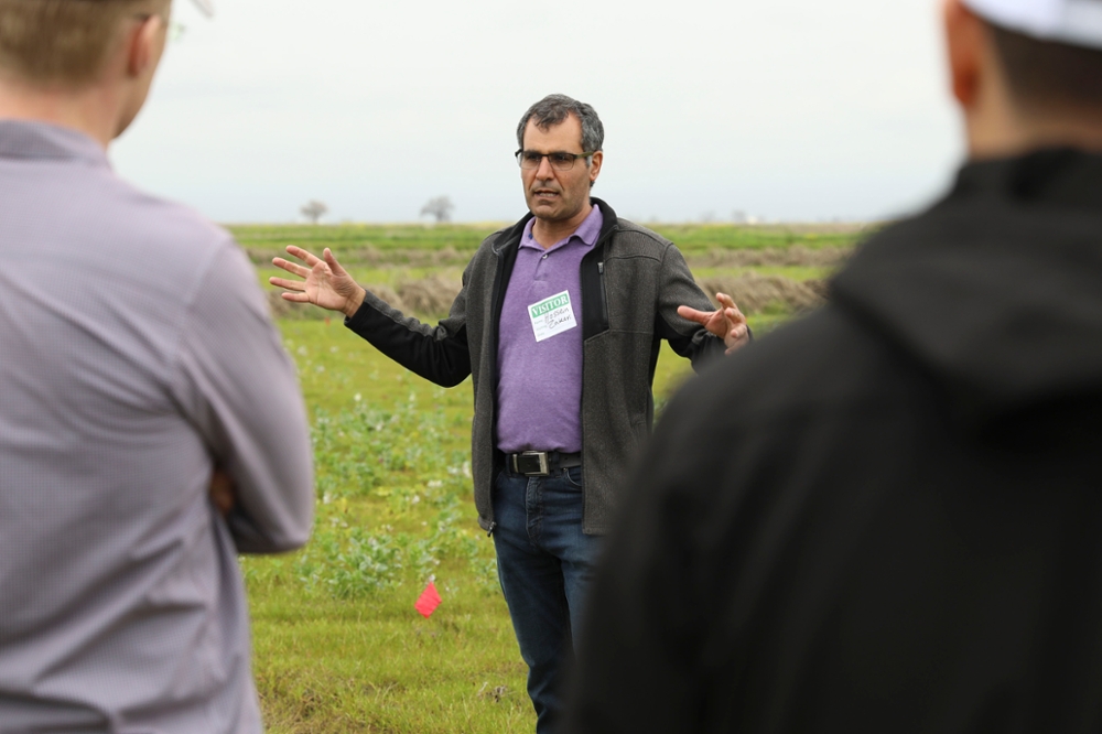Dr. Zakeri Hossain teaches the crowd about fava beans