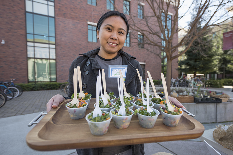 student with organic food samples