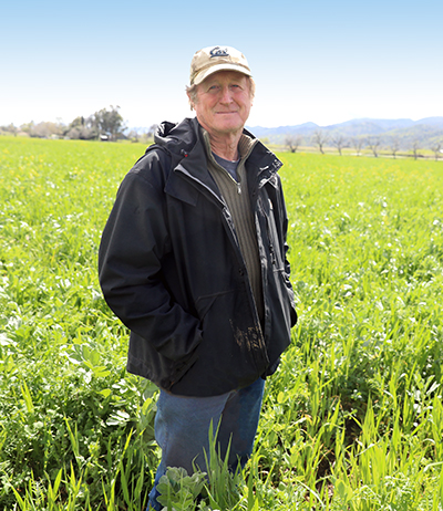 Mentor Farmer Paul Muller standing in his cover crops