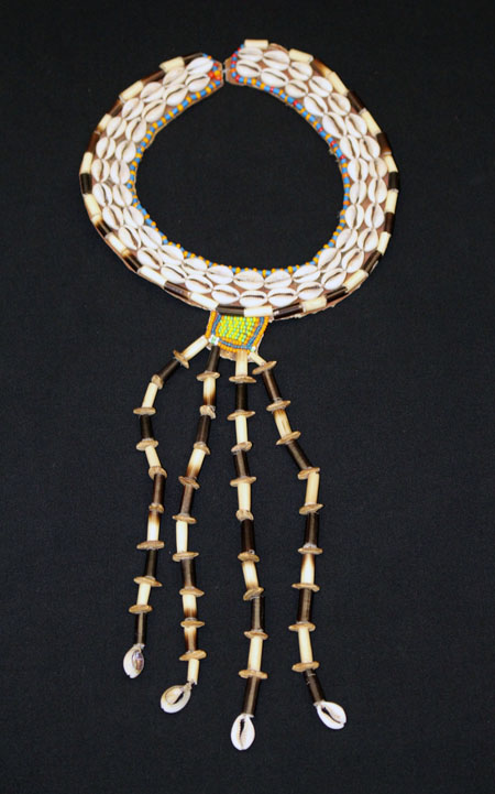 collar necklace made of conch shells and seed beads