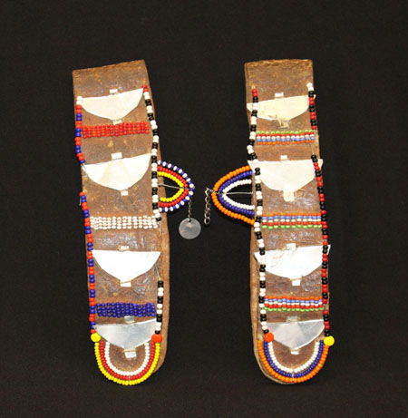 leather flaps decorated with seed beads and metal 