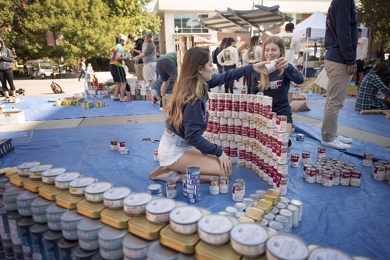 Students stacking canned foods.