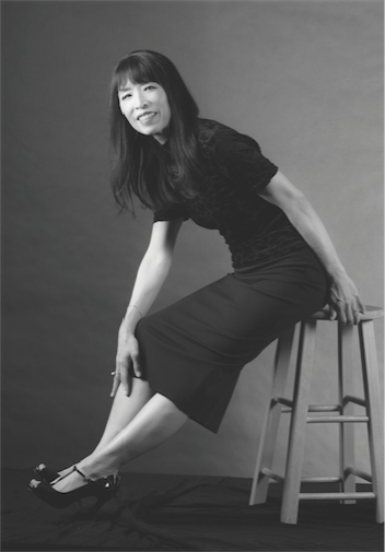 Gloria Cheng sitting on a stool