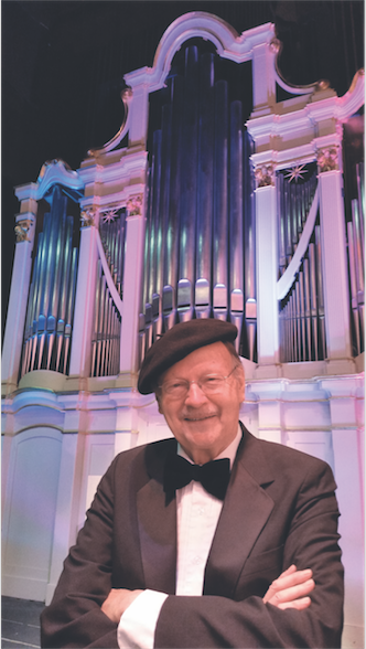 David Rothe in front of the Centennial Organ