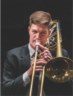 male student playing low brass instrument