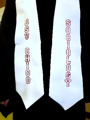 Graduation stole being warn with graduation outfit