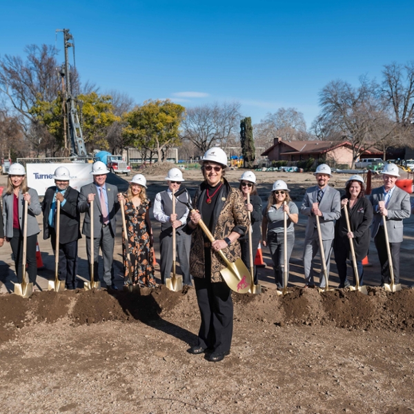 President Gayle Hutchinson (center) and partners hold shovels together at the groundbreaking ceremony for the new College of BSS Building in the footprint of the old Physical Sciences Building.