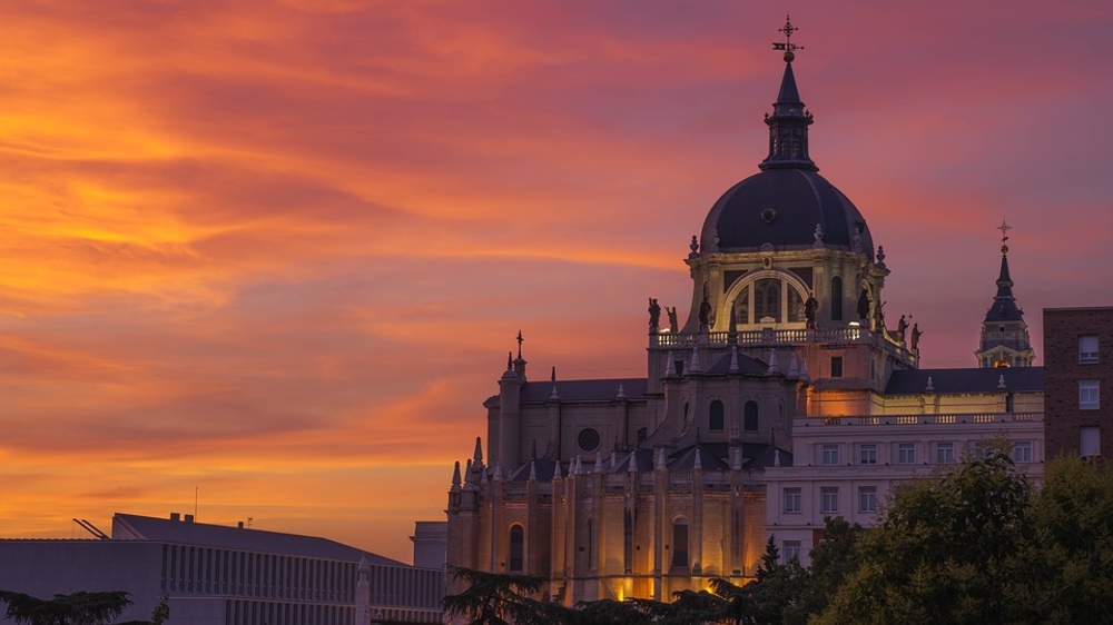 Cathedral in Madrid with a setting sun