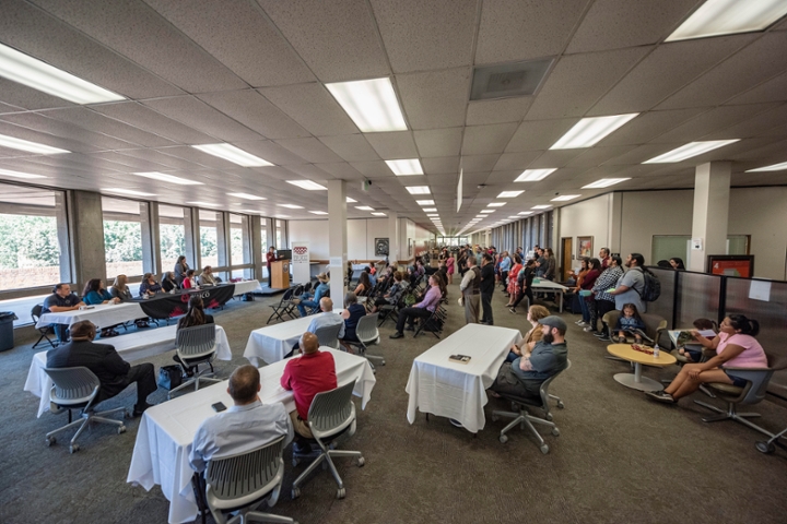 Campus community gathered in the library