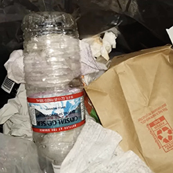 water bottle in the trash