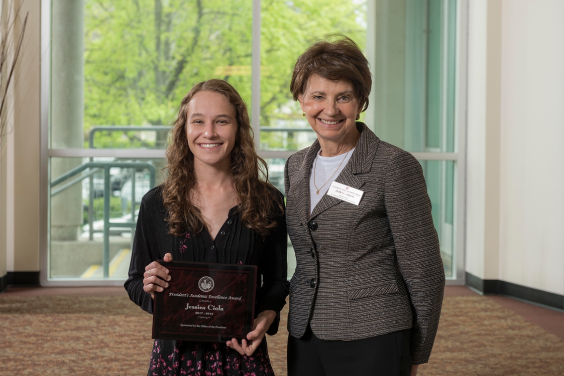 Recipient of the President's Academic Excellence Award Jessica Ciola (left) with presenter Provost Debra Larson (right) during the University Awards